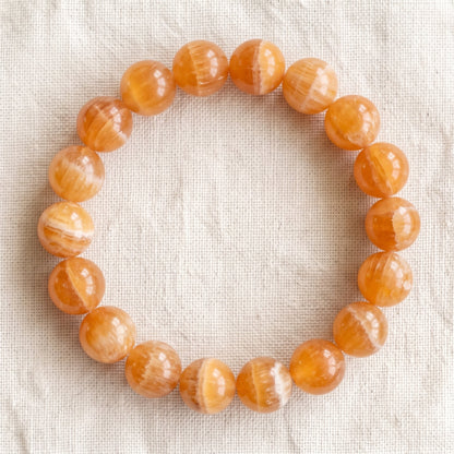 Bracelet en calcite orange, perles de 10 mm - visuel provisoire