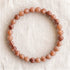 Bracelet en pierre de soleil, perles de 6 mm - visuel provisoire